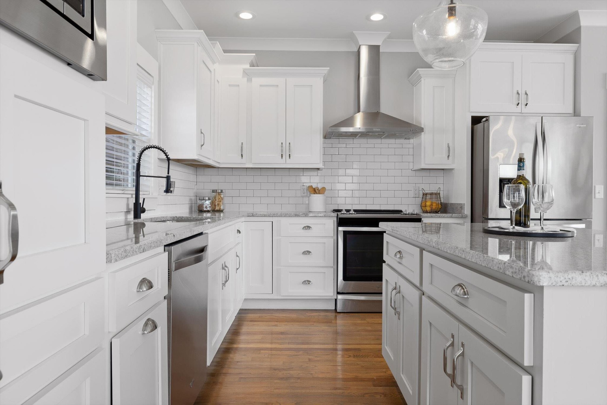 718 Windrush Loop Chattanooga, TN 37421 - Photo 15 of 29 a kitchen with white cabinets and stainless steel appliances