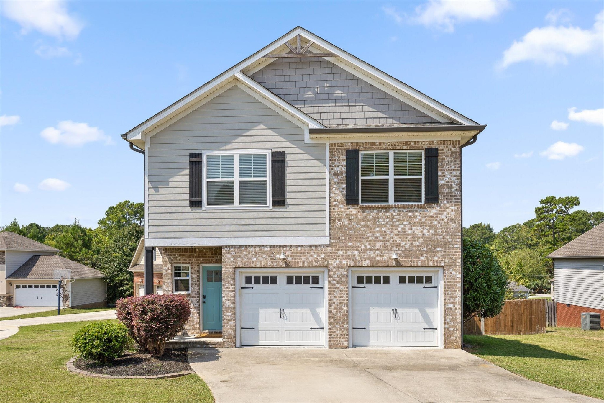 718 Windrush Loop Chattanooga, TN 37421 - Photo 2 of 29 a front view of a house with garden