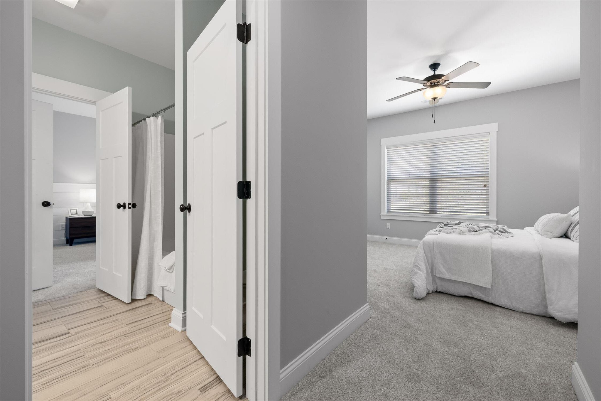 718 Windrush Loop Chattanooga, TN 37421 - Photo 22 of 29 a spacious bedroom with a bed and a chandelier