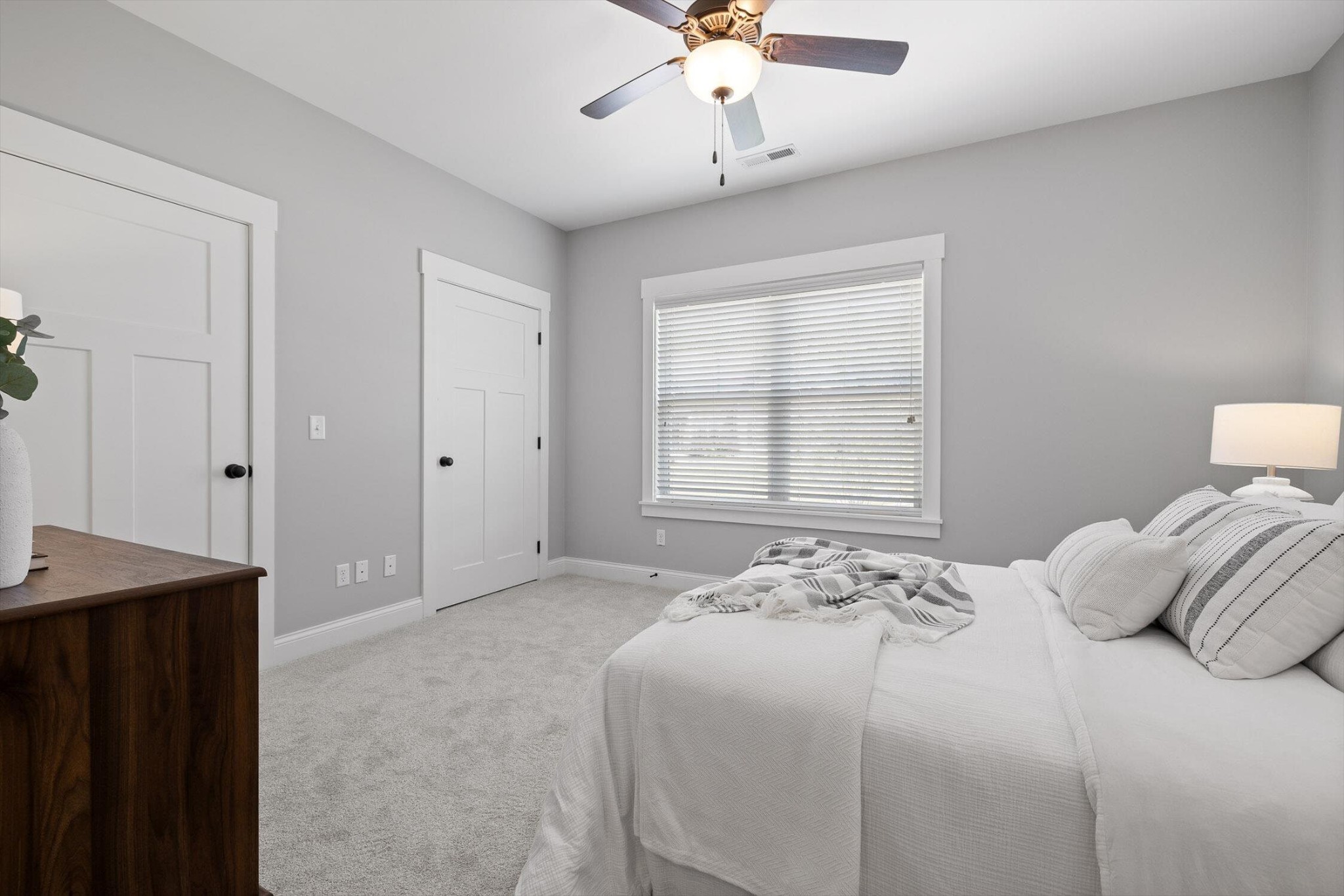 718 Windrush Loop Chattanooga, TN 37421 - Photo 23 of 29 a bedroom with a bed and a chandelier