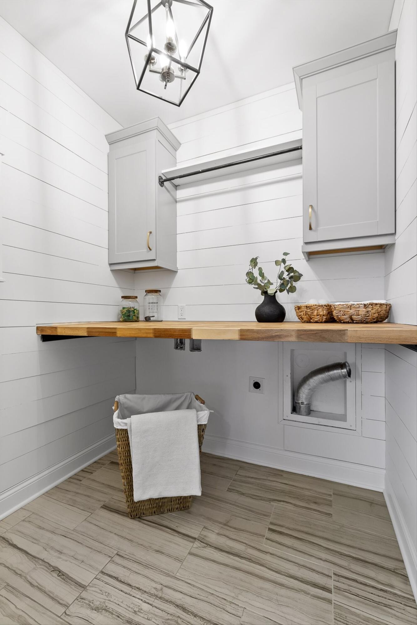718 Windrush Loop Chattanooga, TN 37421 - Photo 25 of 29 a white kitchen with a sink and wooden floor