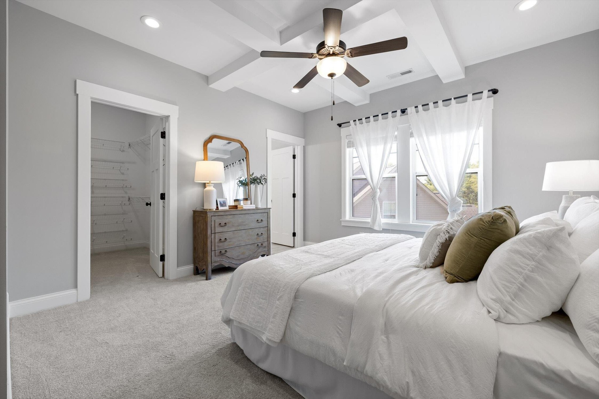 718 Windrush Loop Chattanooga, TN 37421 - Photo 27 of 29 a bedroom with a bed and a chandelier