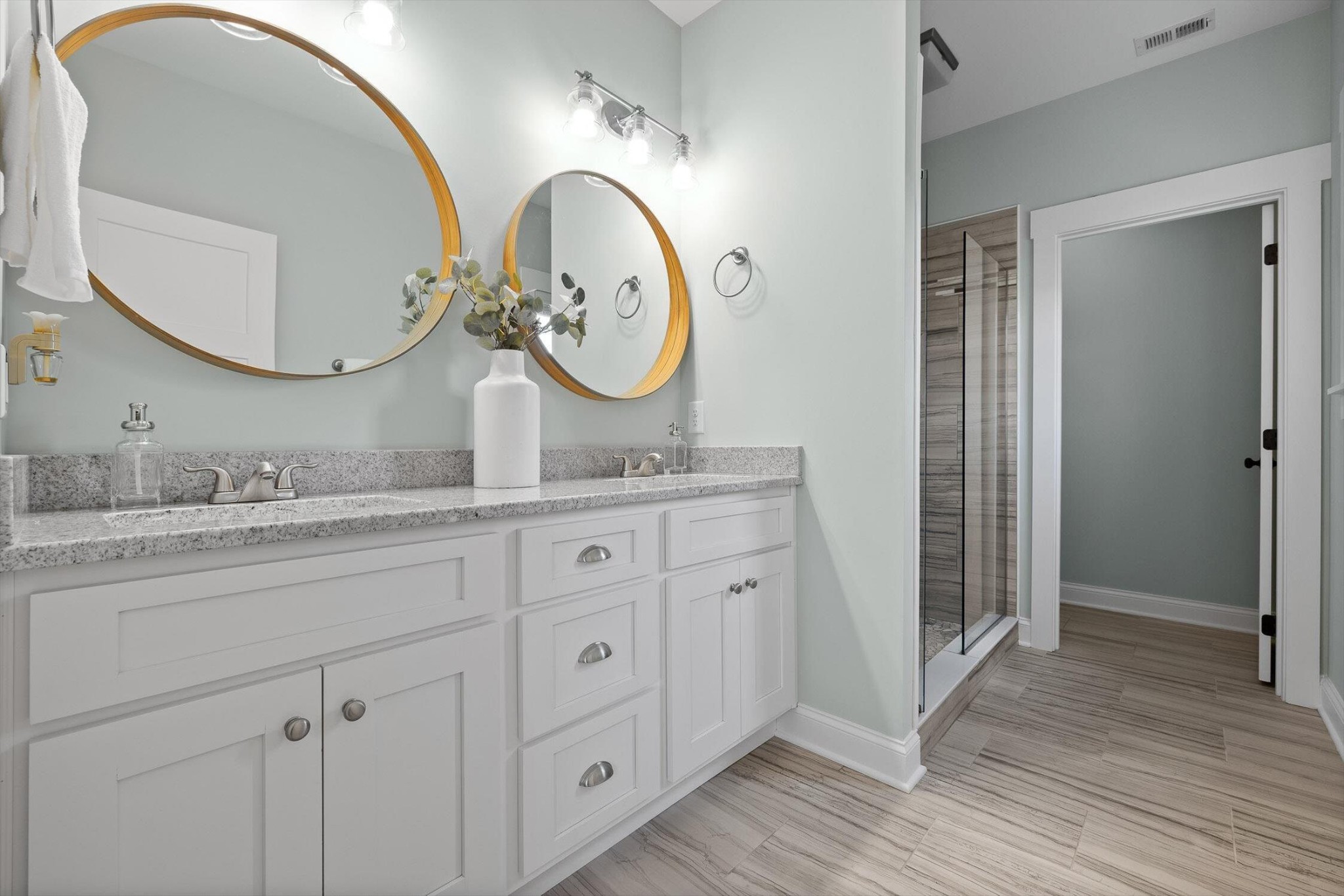 718 Windrush Loop Chattanooga, TN 37421 - Photo 28 of 29 a bathroom with a granite countertop double vanity sink and a mirror