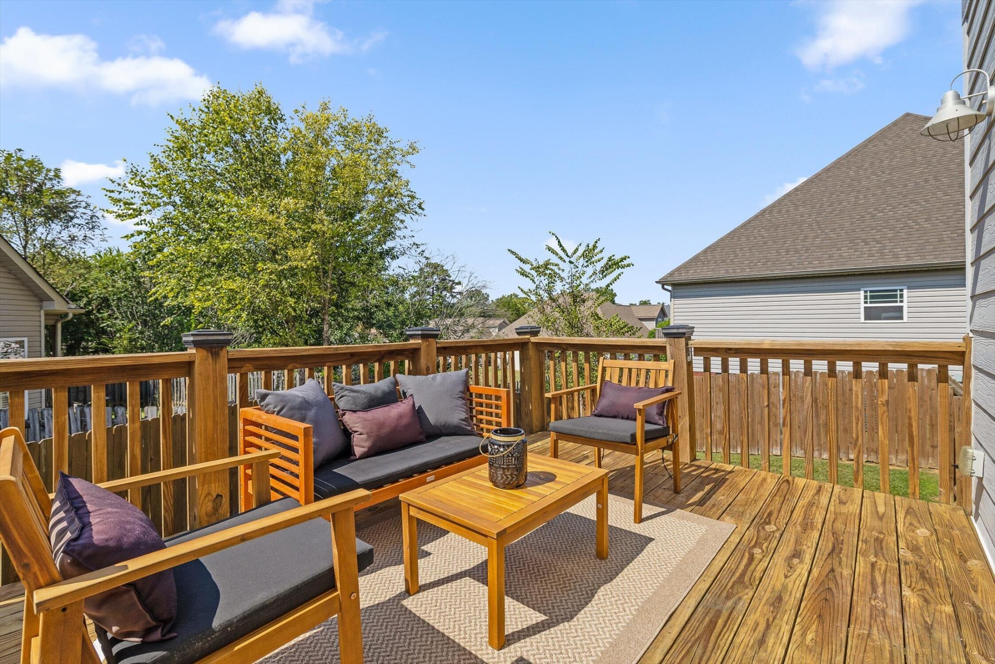 718 Windrush Loop Chattanooga, TN 37421 - Photo 7 of 29 a balcony with wooden floor and outdoor seating