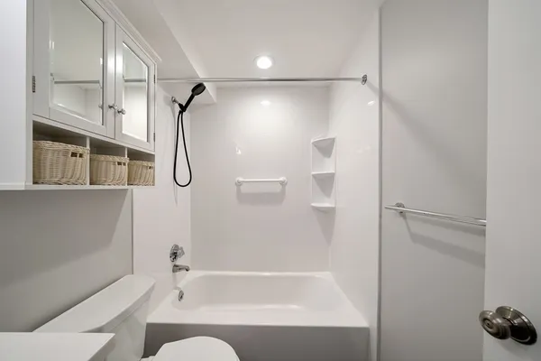 a bathroom with a bathtub and a shower