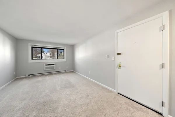 a view of an empty room with a window