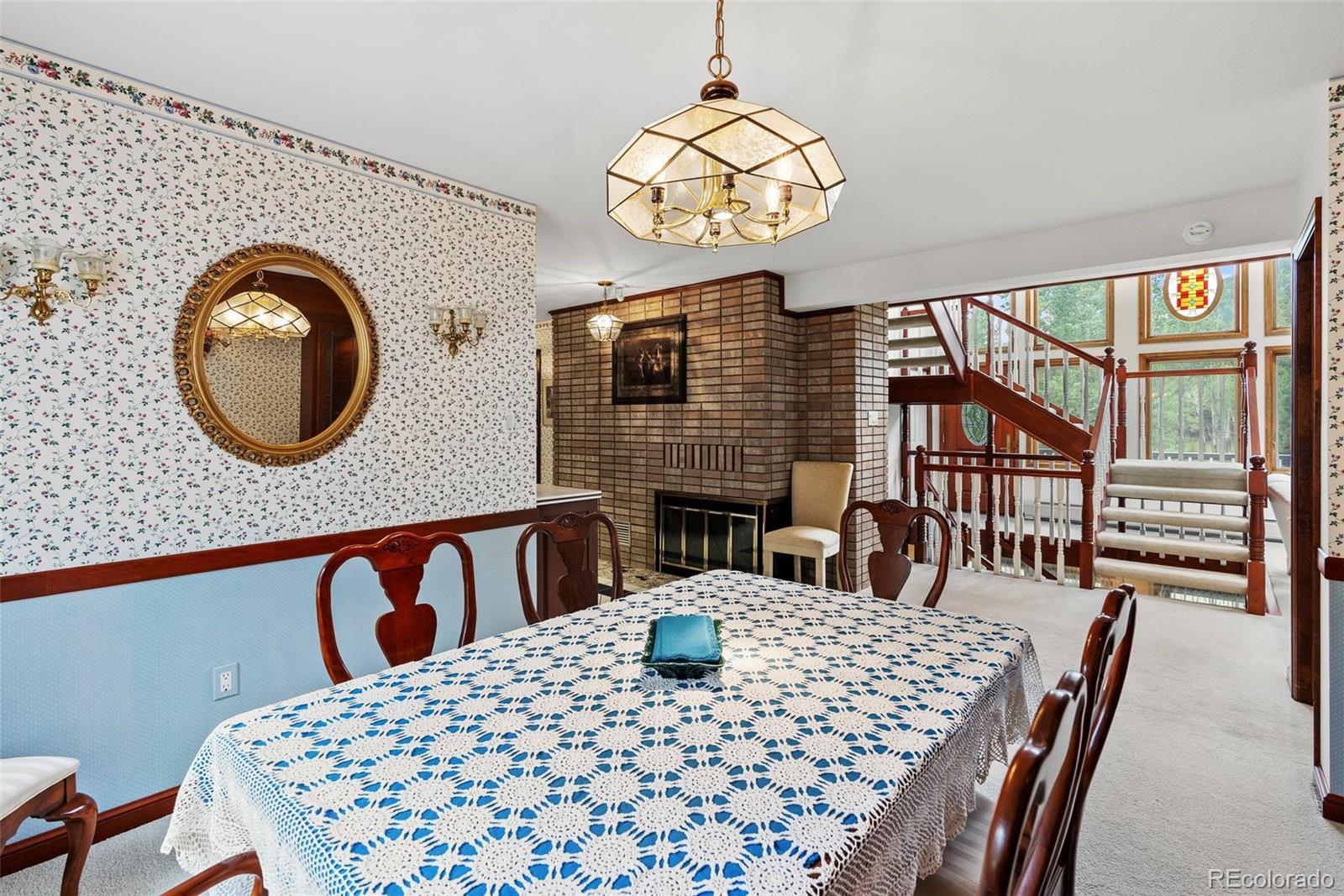 1680 Crow Valley Road Bailey, CO 80421 - Photo 11 of 50 a view of a dining room with furniture