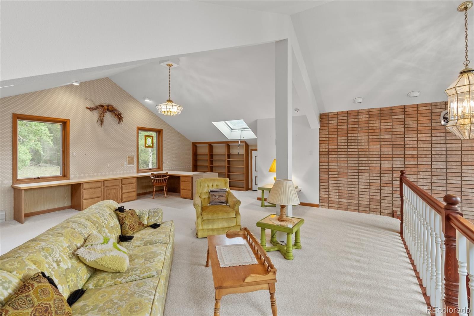 1680 Crow Valley Road Bailey, CO 80421 - Photo 22 of 50 a living room with furniture and wooden floor