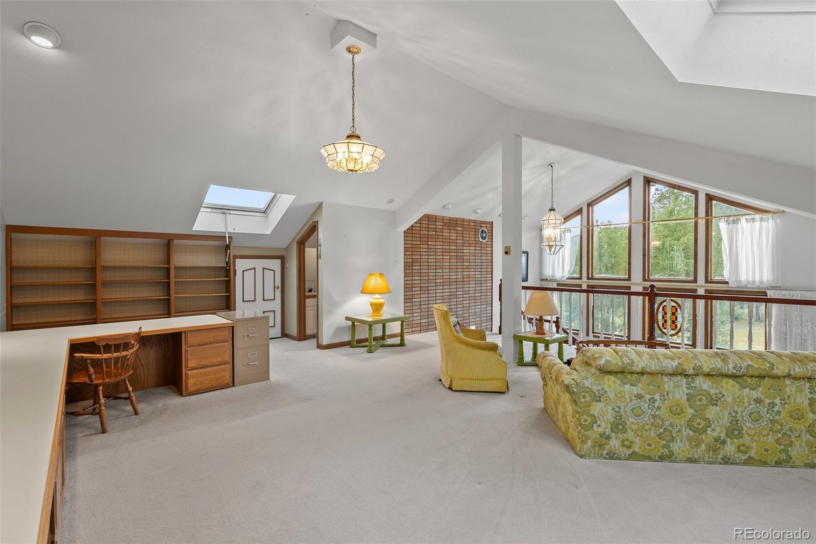 1680 Crow Valley Road Bailey, CO 80421 - Photo 23 of 50 a living room with furniture and window