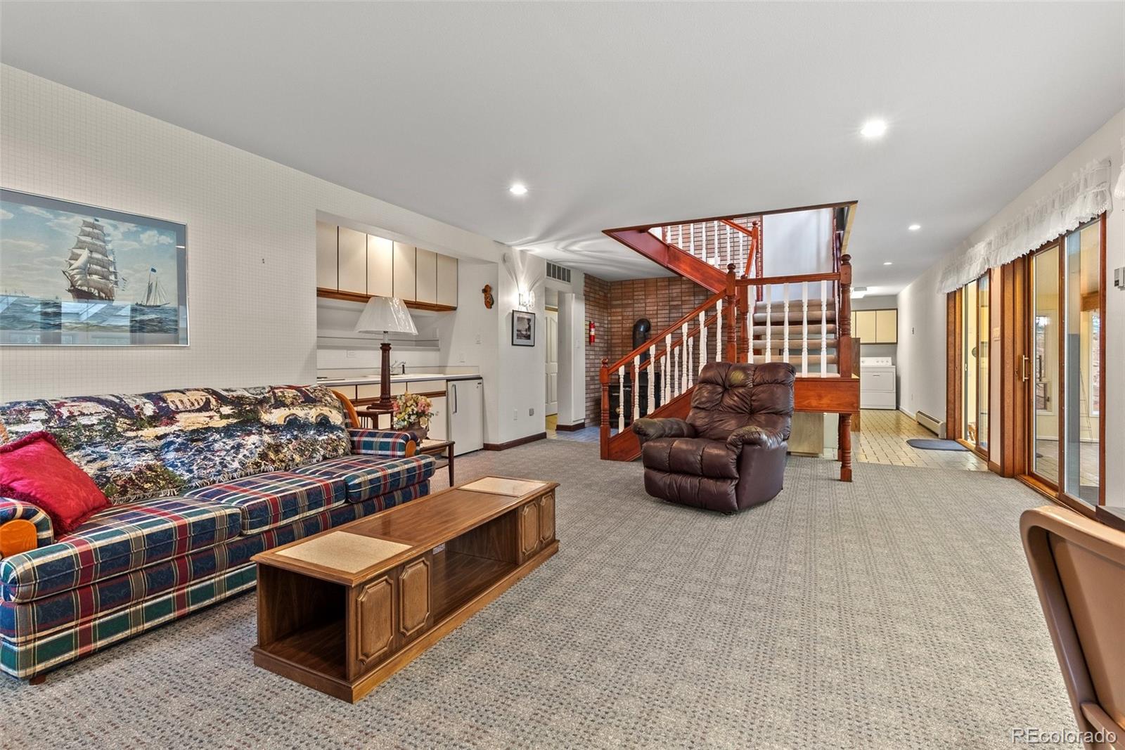 1680 Crow Valley Road Bailey, CO 80421 - Photo 26 of 50 a living room with furniture and a flat screen tv