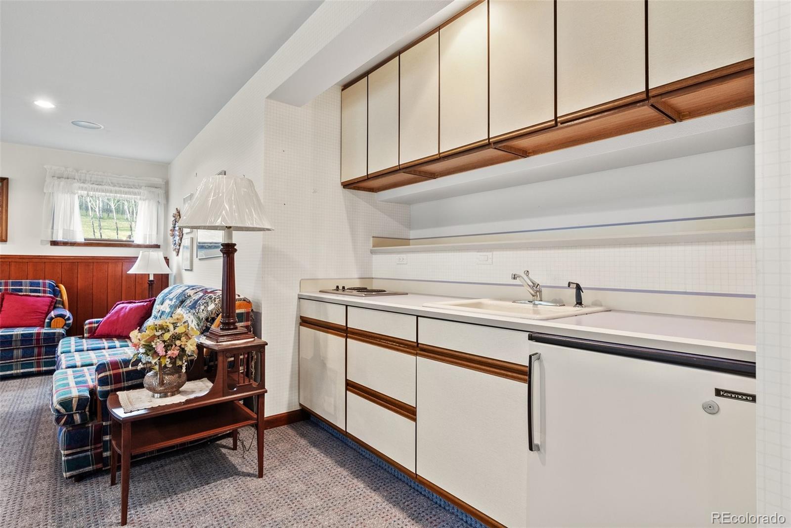 1680 Crow Valley Road Bailey, CO 80421 - Photo 33 of 50 a kitchen with a sink cabinets and window