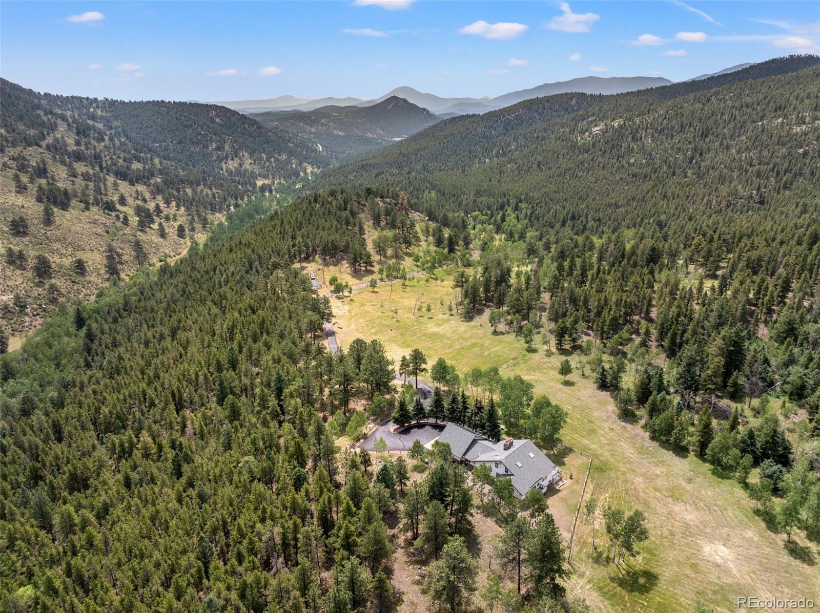 1680 Crow Valley Road Bailey, CO 80421 - Photo 46 of 50 a view of a mountain with mountains in the background