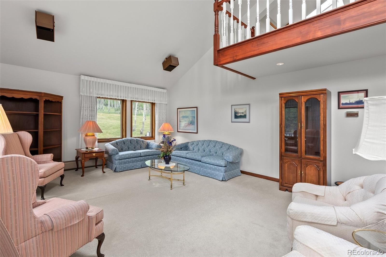 1680 Crow Valley Road Bailey, CO 80421 - Photo 8 of 50 a living room with furniture and a window