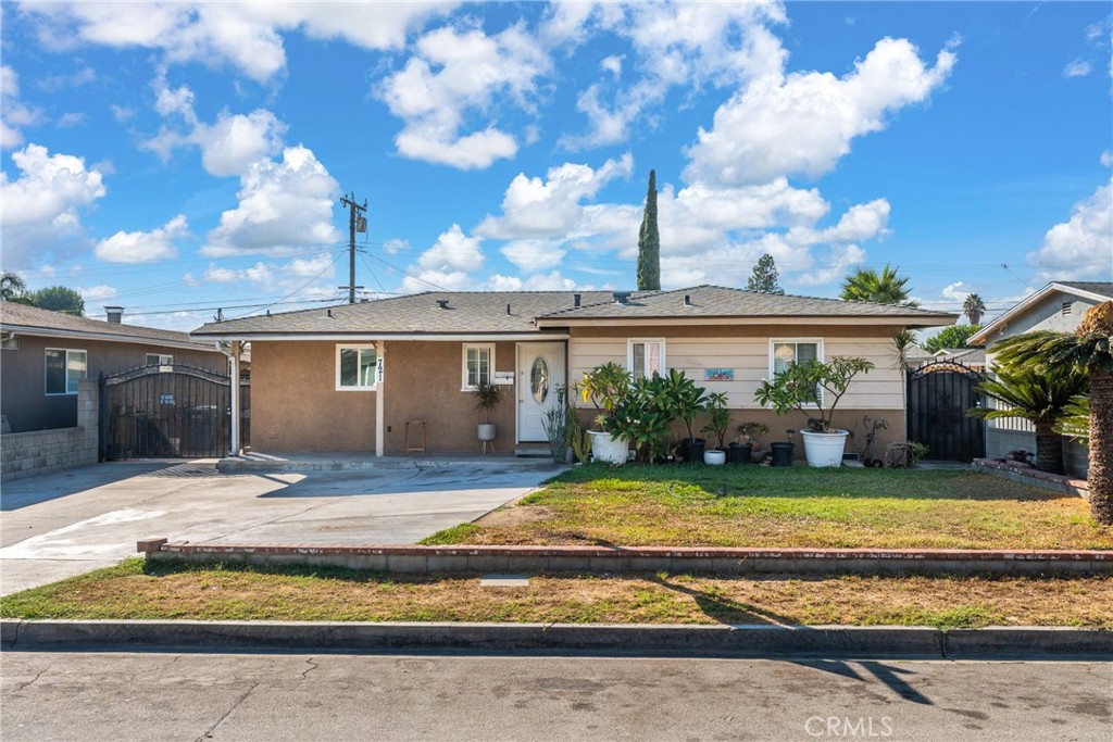 a view of a house with swimming pool and sitting area