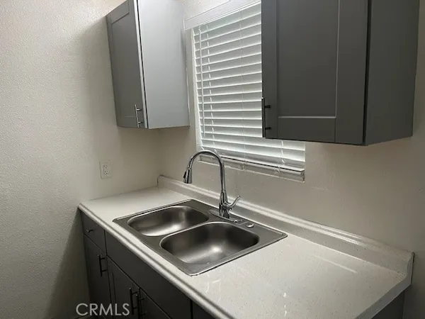 a kitchen with a sink and a window