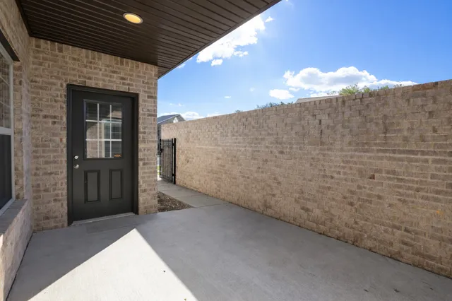 a front view of a house with a large window