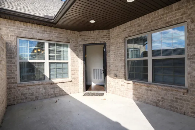 a front view of a house with a large window