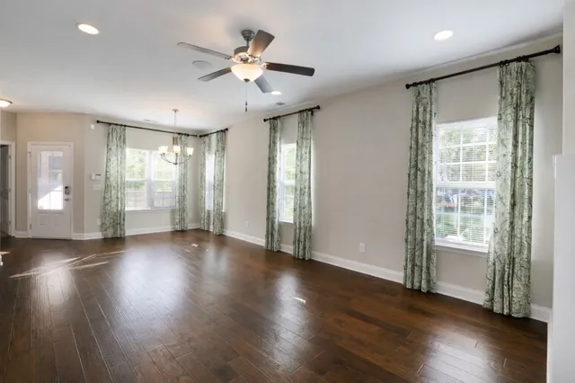 a large kitchen with kitchen island a sink stainless steel appliances and cabinets