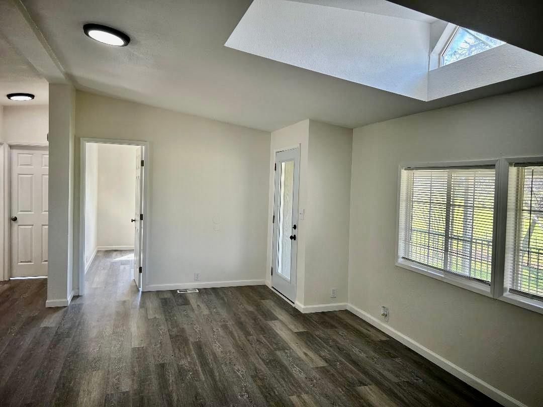 790 Los Verjeles Road Bangor, CA 95901 - Photo 27 of 97 an empty room with wooden floor and windows