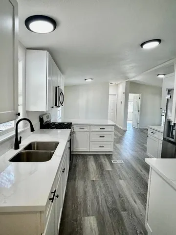 a view of a house with a yard and garage