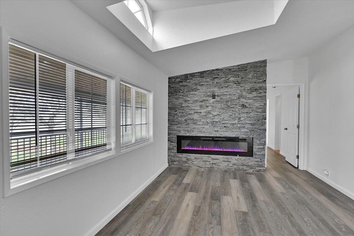 790 Los Verjeles Road Bangor, CA 95901 - Photo 37 of 97 a view of empty room with wooden floor and a fireplace