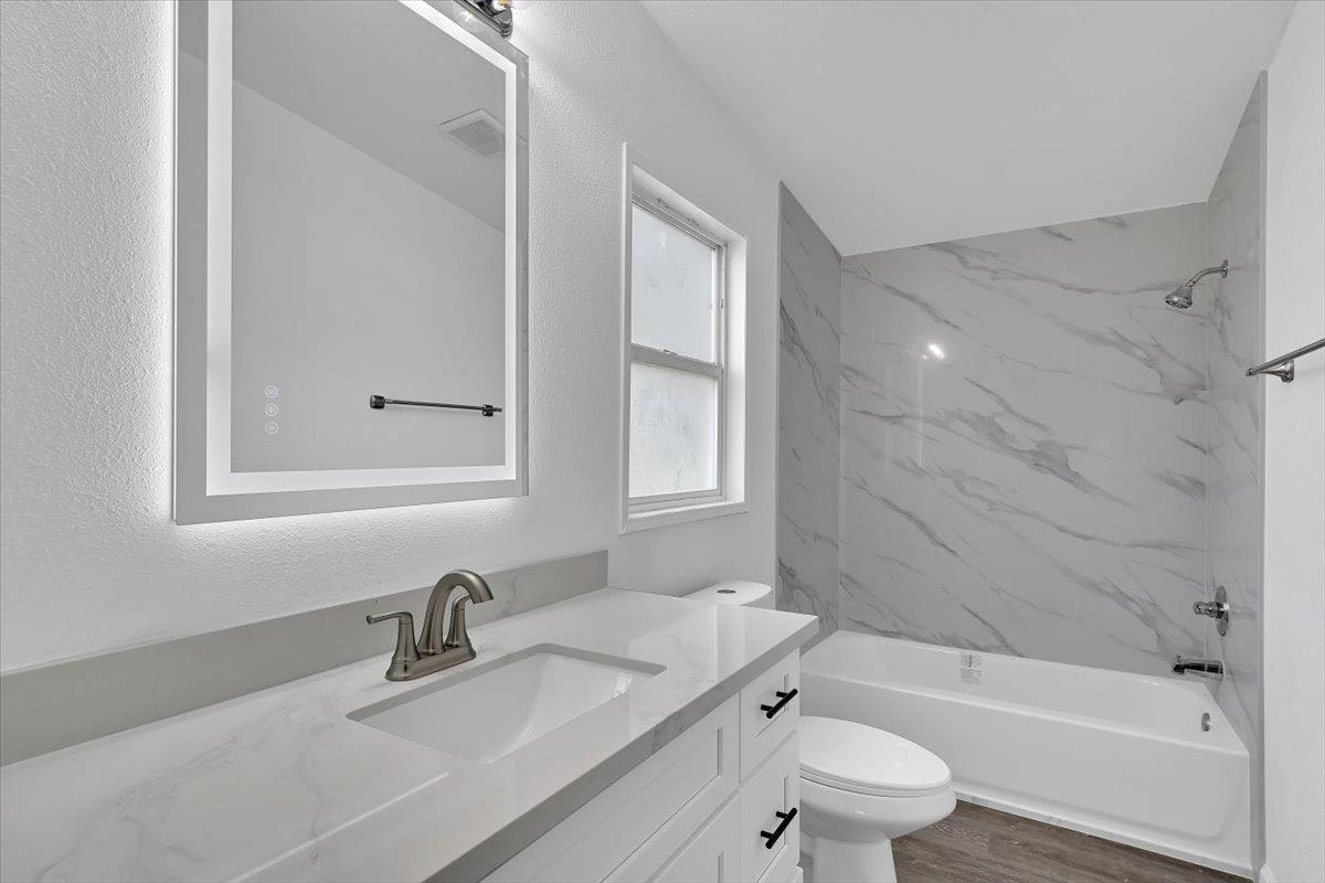 790 Los Verjeles Road Bangor, CA 95901 - Photo 47 of 97 a bathroom with a granite countertop sink toilet and shower