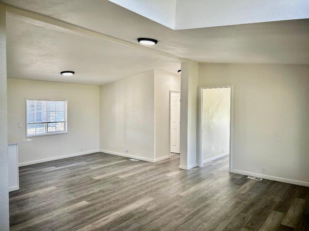 790 Los Verjeles Road Bangor, CA 95901 - Photo 84 of 97 an empty room with wooden floor and windows