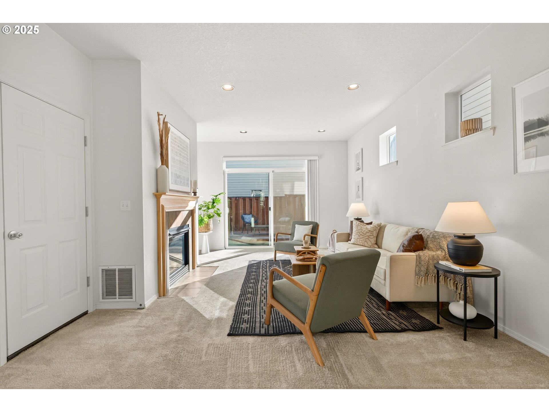 6262 Southwest 205th Avenue Beaverton, OR 97078 - Photo 13 of 36 a living room with furniture and a dining table with kitchen view