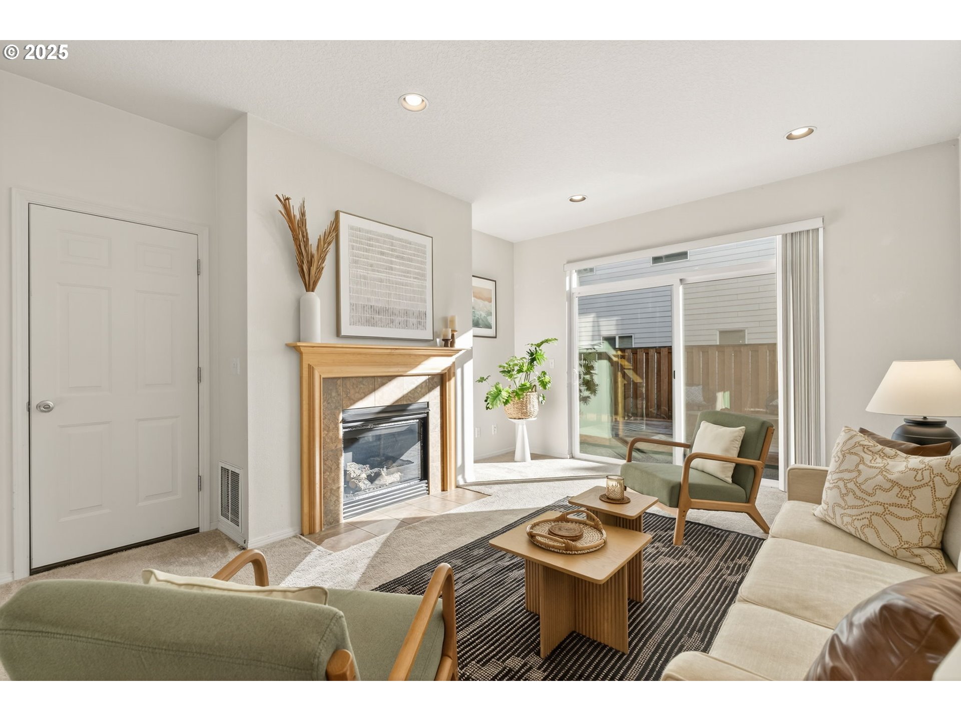 6262 Southwest 205th Avenue Beaverton, OR 97078 - Photo 14 of 36 a living room with furniture and a fireplace