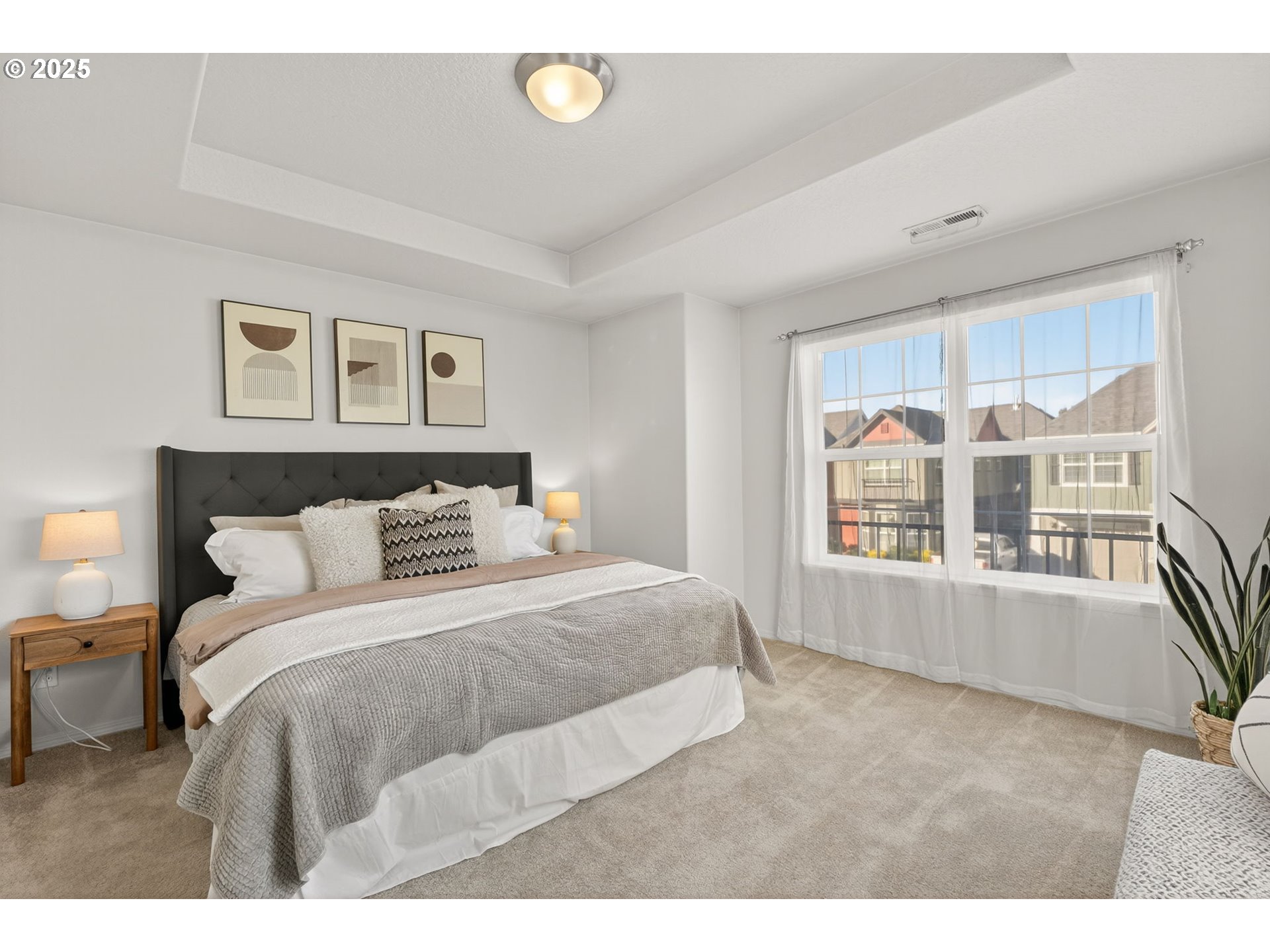 6262 Southwest 205th Avenue Beaverton, OR 97078 - Photo 20 of 36 a bedroom with a large bed and a window