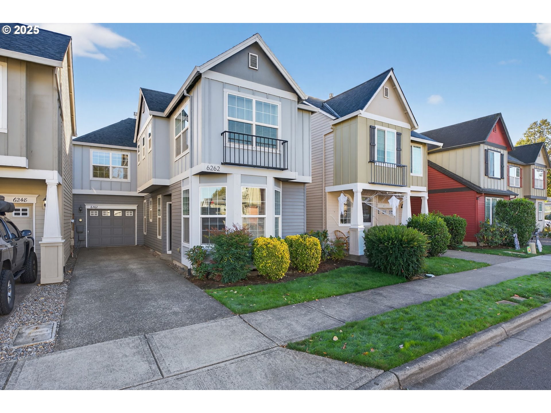 6262 Southwest 205th Avenue Beaverton, OR 97078 - Photo 2 of 36 a front view of a house with a garden
