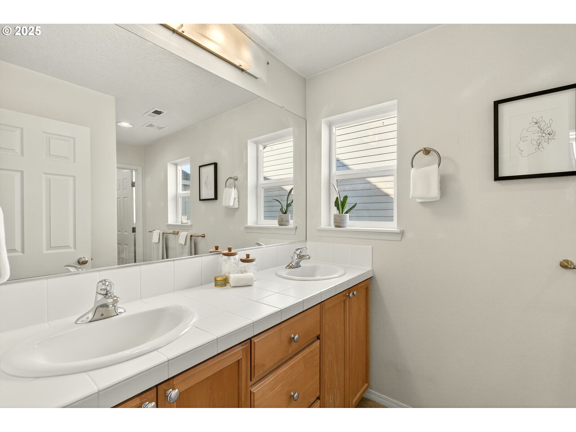 6262 Southwest 205th Avenue Beaverton, OR 97078 - Photo 22 of 36 a bathroom with a sink and a mirror
