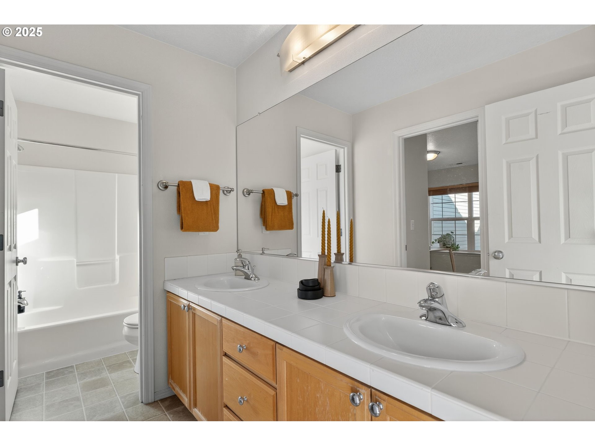 6262 Southwest 205th Avenue Beaverton, OR 97078 - Photo 33 of 36 a bathroom with a sink and a mirror