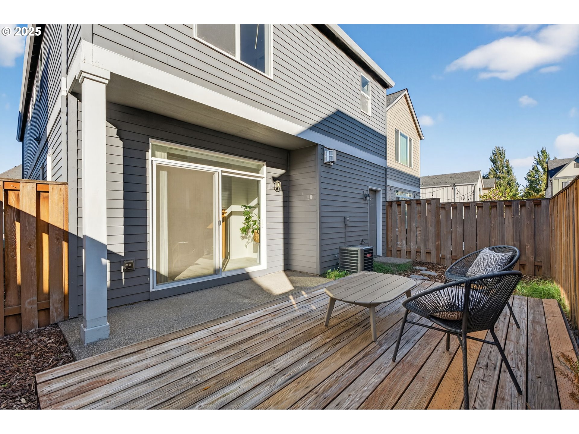 6262 Southwest 205th Avenue Beaverton, OR 97078 - Photo 34 of 36 a view of deck with table and chairs and wooden floor