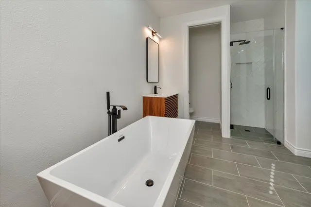 a bathroom with a bathtub and a sink