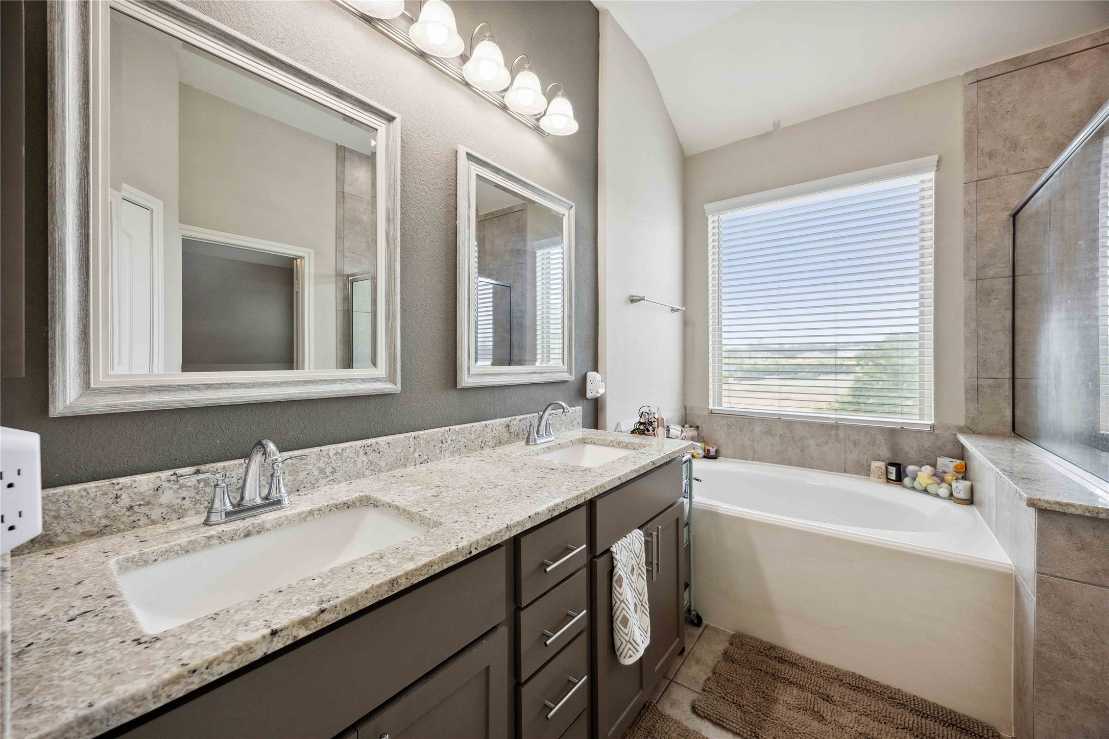 323 Biltmore Loop Montgomery, TX 77316 - Photo 21 of 27 Soak in the spa-like atmosphere with abundant natural light from the large window.