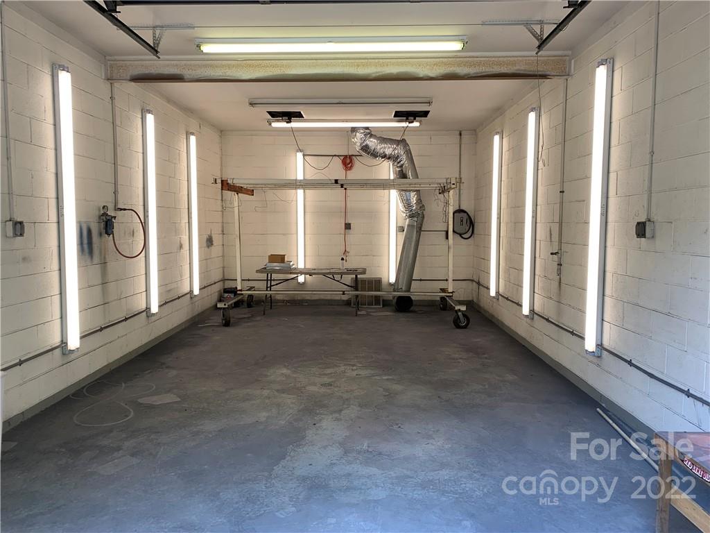 3306 Mt Pleasant Road South Concord, NC 28025 - Photo 22 of 33 a view of a room with gym equipment and floor to ceiling window
