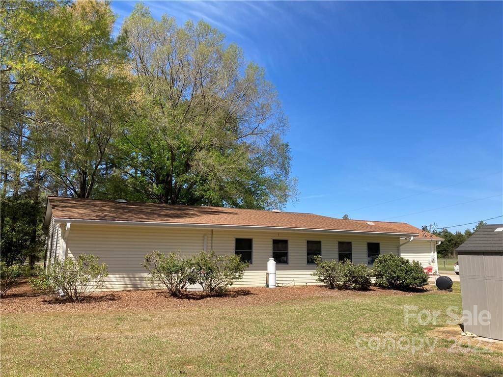 3306 Mt Pleasant Road South Concord, NC 28025 - Photo 29 of 33 a front view of a house with a yard