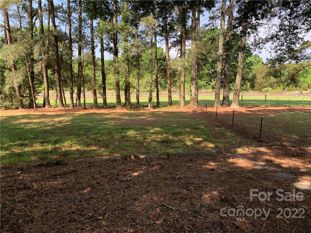 3306 Mt Pleasant Road South Concord, NC 28025 - Photo 33 of 33 a big yard with lots of green space and trees