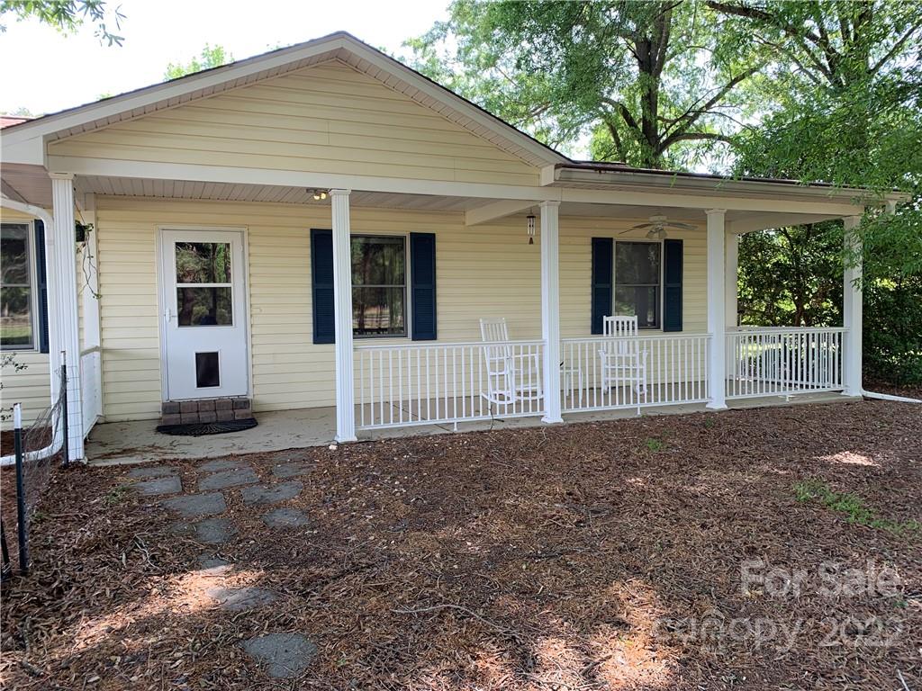3306 Mt Pleasant Road South Concord, NC 28025 - Photo 6 of 33 a view of a house with a small yard and large tree