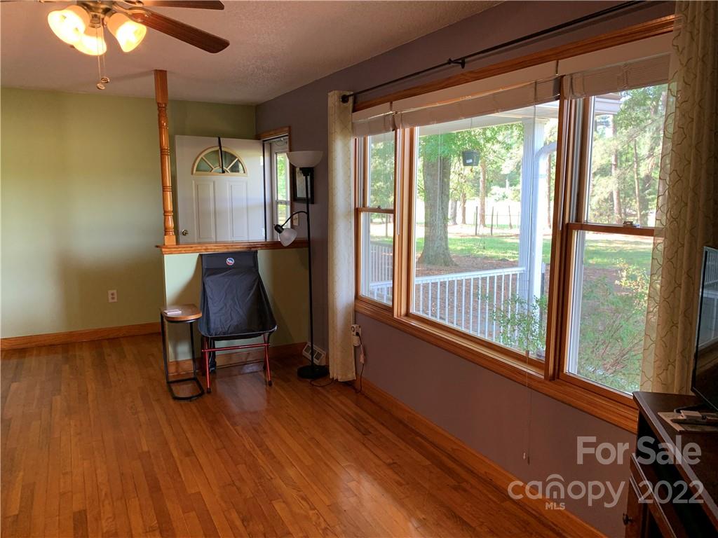 3306 Mt Pleasant Road South Concord, NC 28025 - Photo 7 of 33 a view of a room with wooden floor and windows