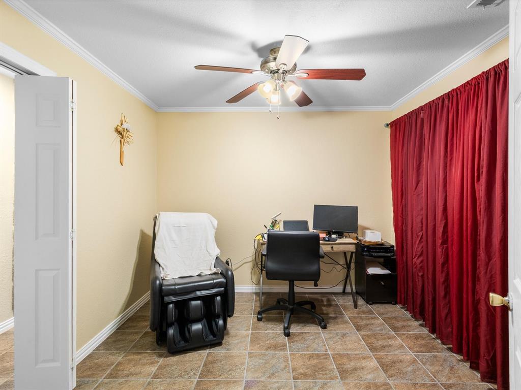 1318 Brook Valley Lane Dallas, TX 75232 - Photo 17 of 39 a view of a workspace with furniture and a window