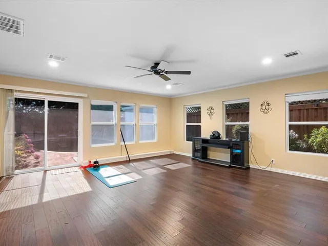 a living room with furniture window and wooden floor