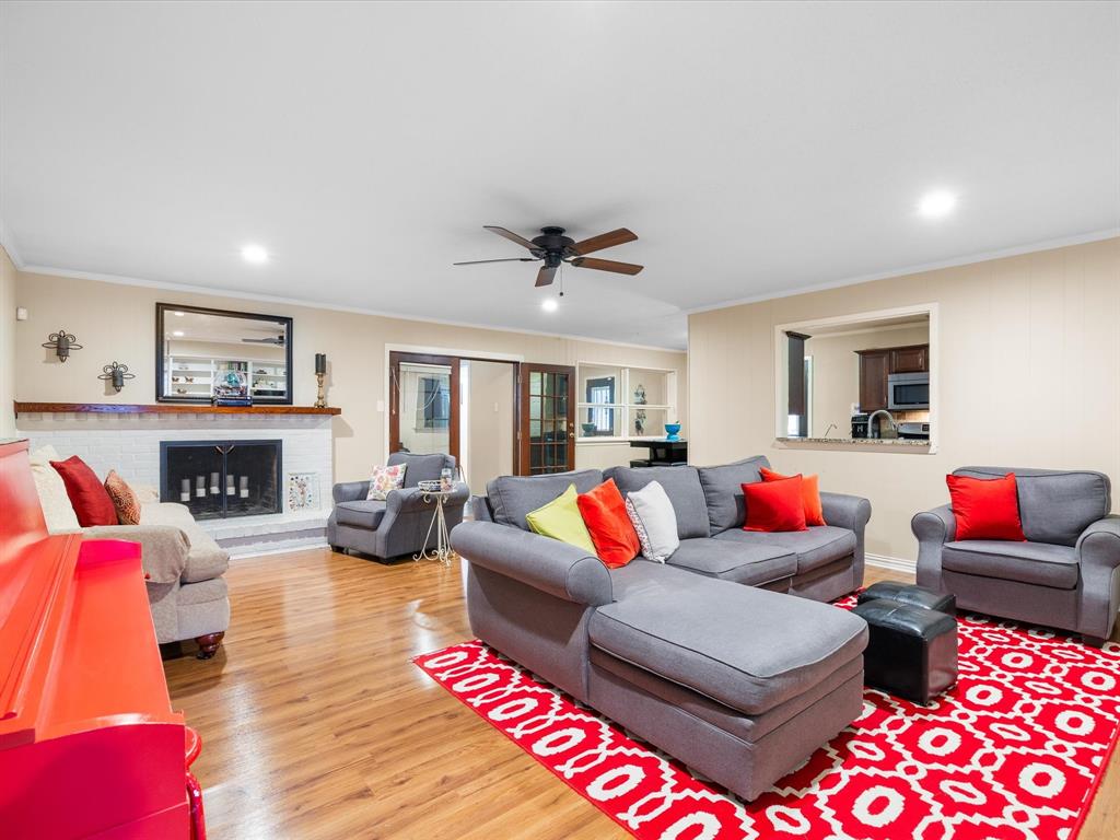 1318 Brook Valley Lane Dallas, TX 75232 - Photo 24 of 39 a living room with furniture fireplace and a table