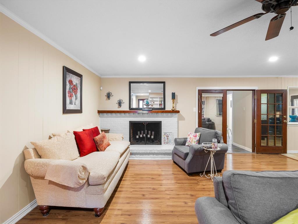 1318 Brook Valley Lane Dallas, TX 75232 - Photo 25 of 39 a living room with furniture and a fireplace