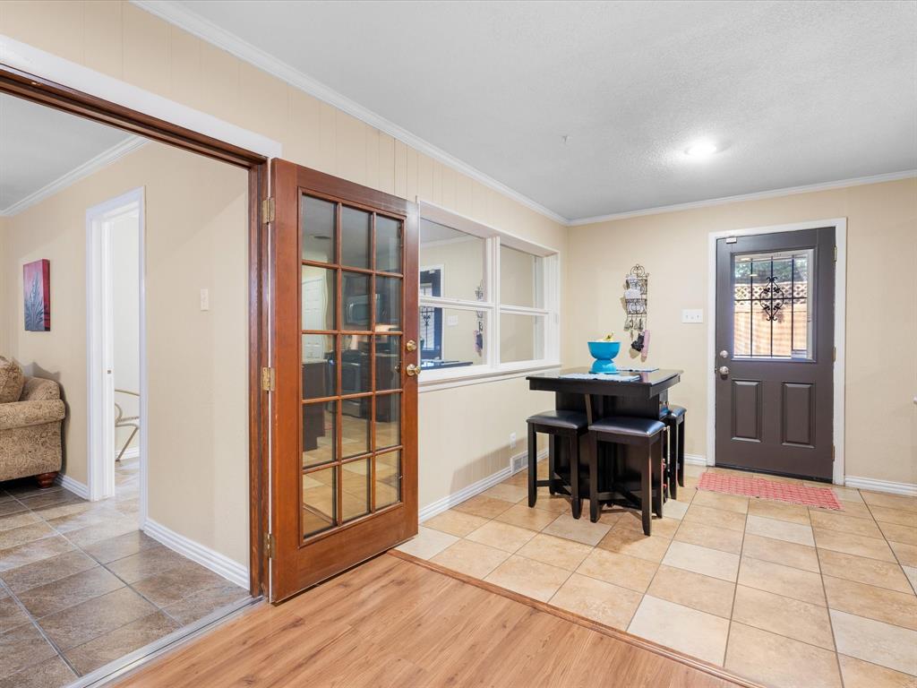 1318 Brook Valley Lane Dallas, TX 75232 - Photo 26 of 39 a dining room with furniture and window