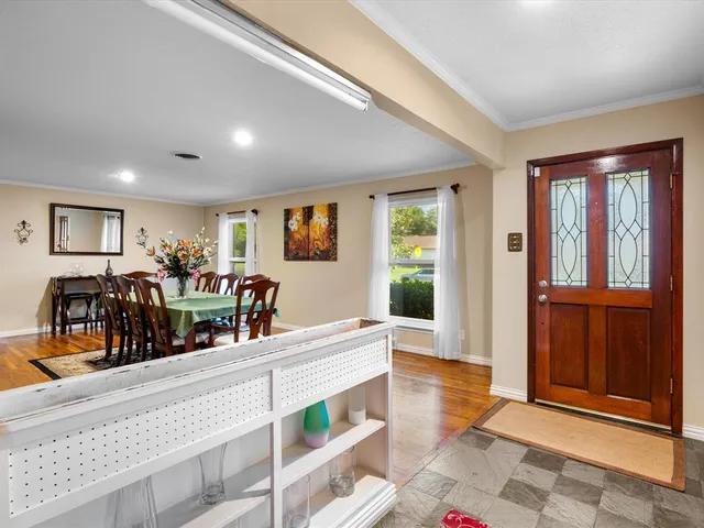 a view of a living room and dining room