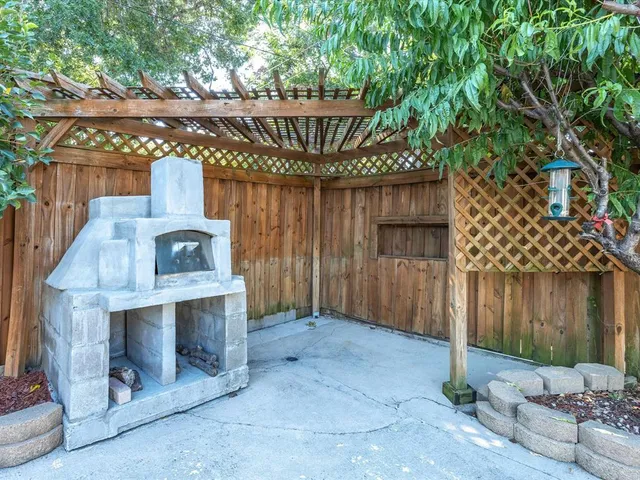 a view of a wooden deck front of house