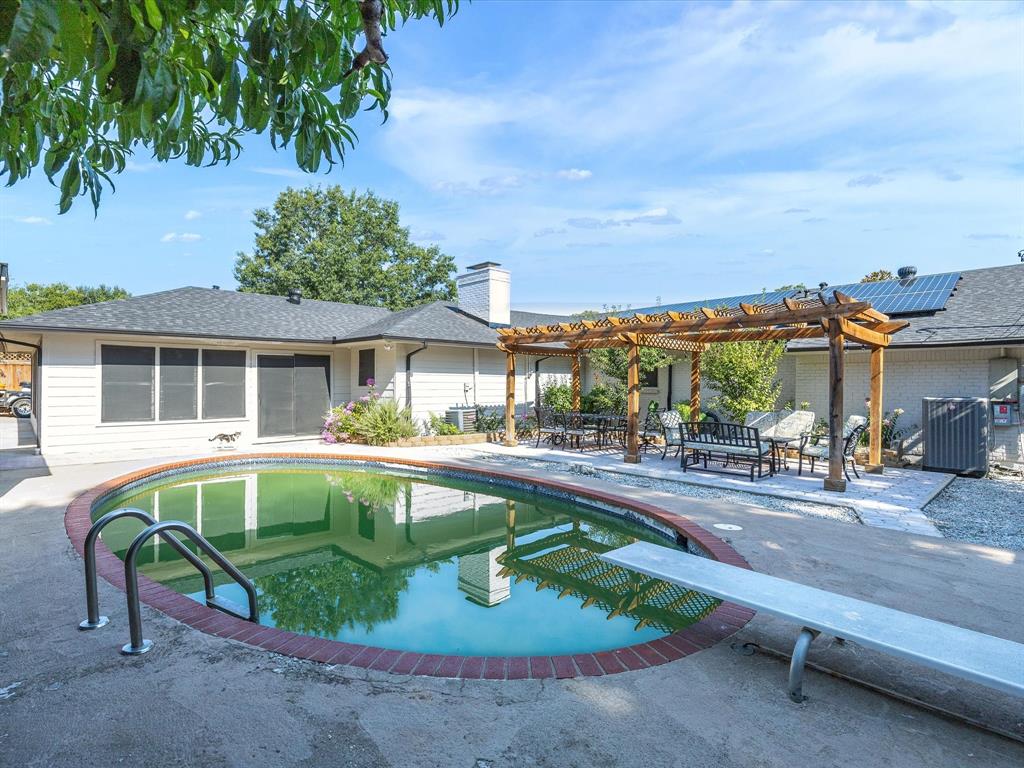 1318 Brook Valley Lane Dallas, TX 75232 - Photo 36 of 39 a house view with a seating space and garden
