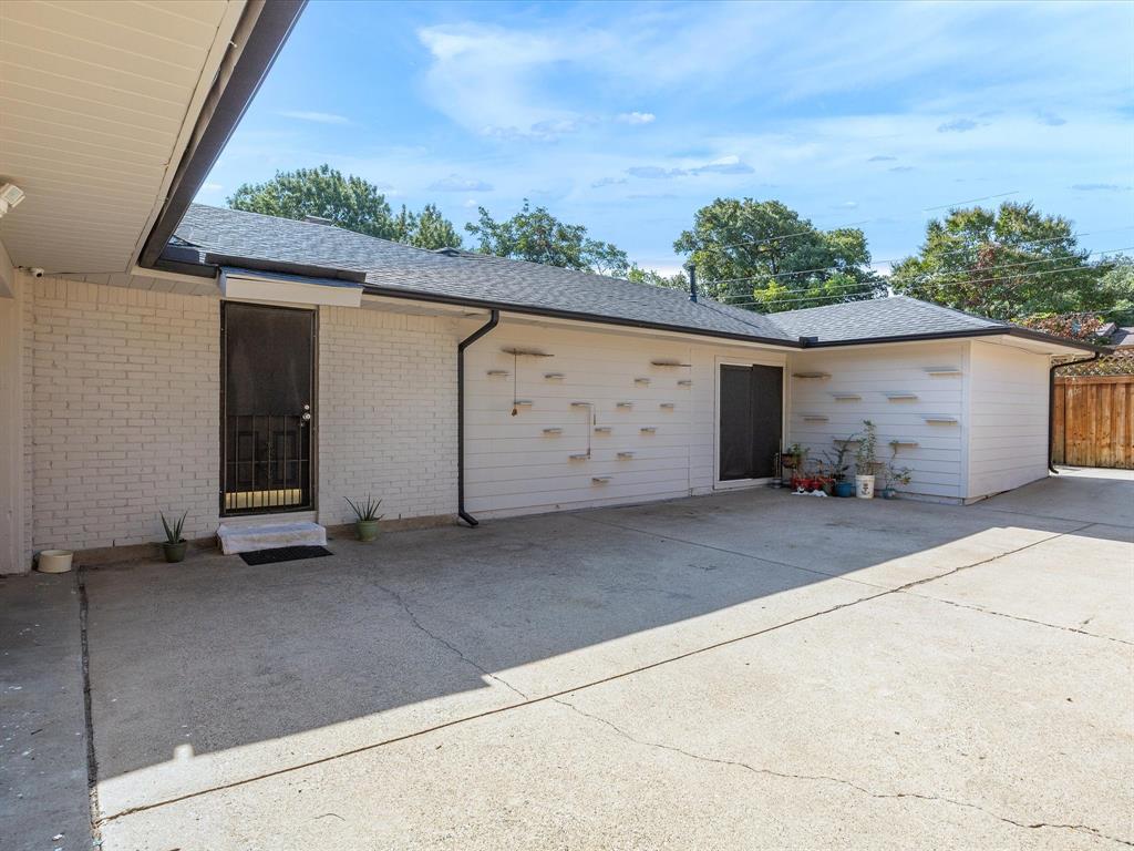 1318 Brook Valley Lane Dallas, TX 75232 - Photo 39 of 39 front view of a house with a garage
